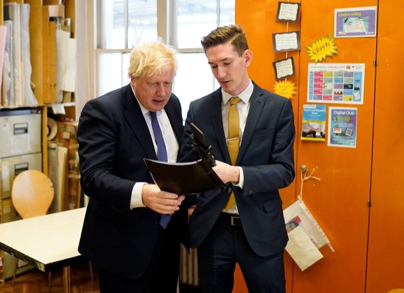 Robert Midgley reviewing material with Prime Minister Boris Johnson during a visit